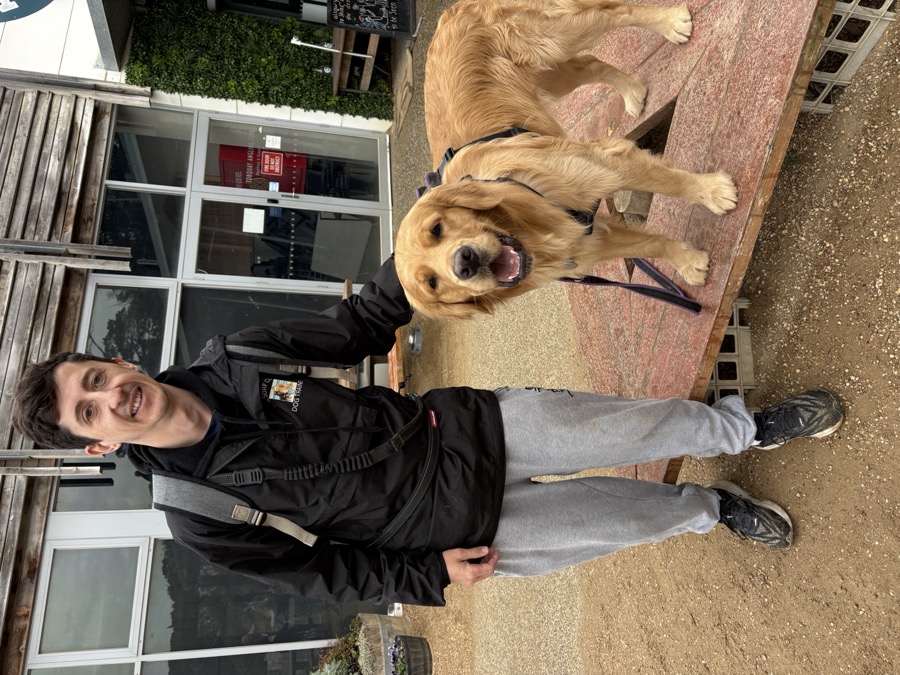 Cameron Fennell with a golden retriever outside the Torquay training venue